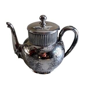 Victorian Aesthetic Movement Wilcox silver-plated teapot with floral engravings.